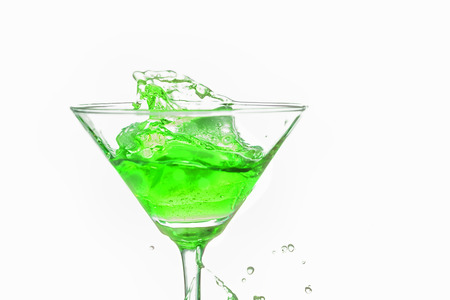 Green cocktail splash on white background close upの写真素材