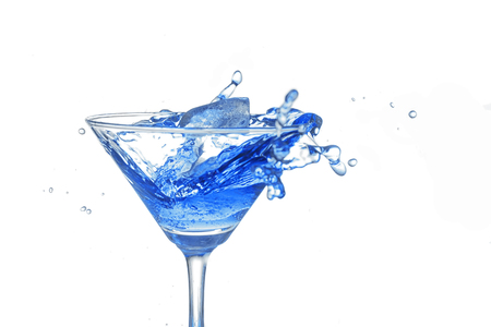 blue cocktail splash on white background close upの写真素材