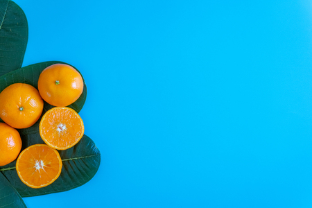 Summer fruit of orange with desktop on plates blue background. topview or flat lay fruit.の写真素材