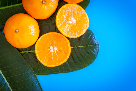 Summer fruit of orange with desktop on plates blue background. topview or flat lay fruit.の写真素材