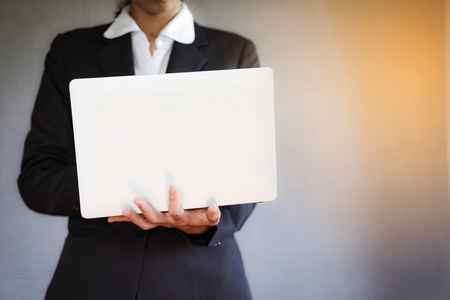 Business young woman using laptop at office.の写真素材