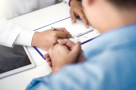 Doctor explain health check document of male patient in medical clinic or hospital health. health and doctor concept.の写真素材