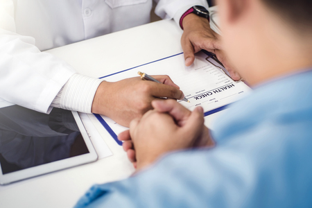 Doctor explain health check document of male patient in medical clinic or hospital health. health and doctor concept.の写真素材