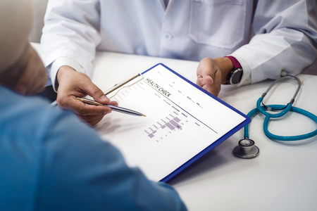Doctor explain health check document of male patient in medical clinic or hospital health. health and doctor concept.の写真素材