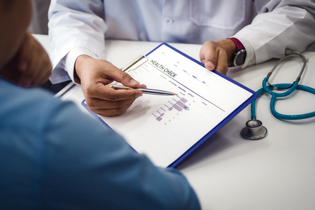 Doctor explain health check document of male patient in medical clinic or hospital health. health and doctor concept.の写真素材