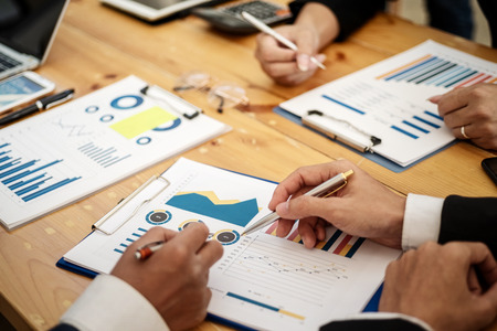 Business team professionals working analyzing data with financial report in the office. Accounting concept.の写真素材