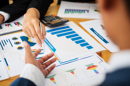 Group of business people discussing project plan together with analyzing data financial report in meeting room. Finance accounting concept.の写真素材