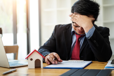 Business man eyes fatigue at work about feeling  strain tension problem. business strain concept.の写真素材