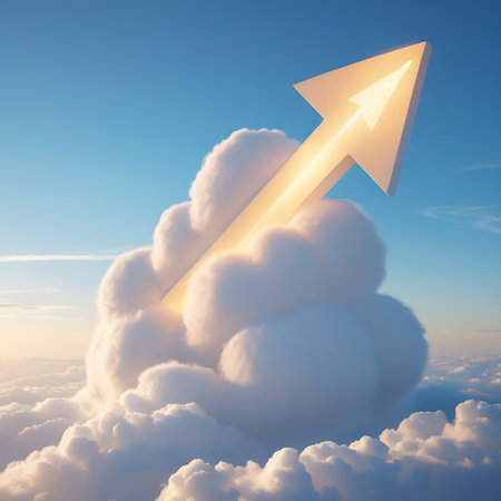 A prominent, bright arrow shape is formed by or emerging from a large, fluffy cloud. The arrow is pointing upwards and diagonally, breaking through the cloud mass. The scene is set against a clear blue sky with softer clouds in the distance, illuminated by a warm, golden light, possibly from sunrise or sunset. The image symbolizes a powerful ascent, breakthrough, or achievement.の素材
