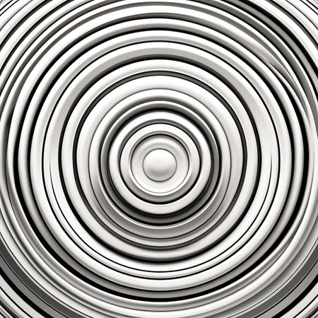 This abstract image displays a close-up view of concentric circles with a highly reflective metallic silver texture. The circles are arranged in a rippling, wave-like pattern, creating a sense of depth and movement. The smooth, polished surface catches the light, resulting in subtle gradients and highlights that enhance the visual appeal.の素材