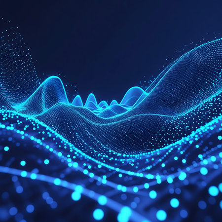 An abstract digital waveform composed of numerous small, glowing blue particles. The particles form undulating waves and peaks against a dark background, suggesting data flow, sound waves, or a futuristic digital landscape. The illumination creates a sense of depth and movement.の素材