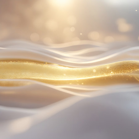 An abstract composition featuring flowing waves of soft white and shimmering gold fabric. The material appears smooth and luxurious, with subtle sparkles and bokeh lights scattered throughout, creating a dreamy and ethereal effect. The gentle curves and luminous quality suggest elegance and sophistication.の素材