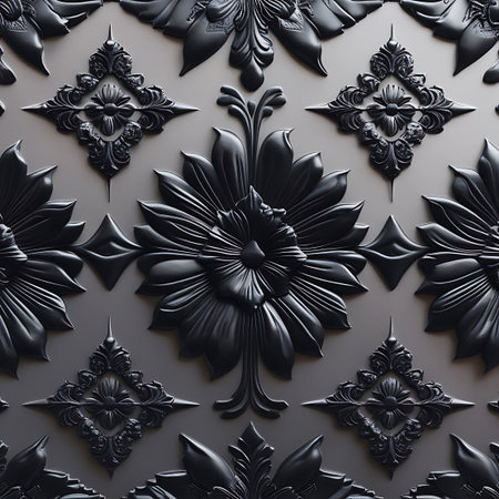 A repeating pattern of black, ornate floral motifs is embossed on a textured gray background. The design features large, detailed flower heads with layered petals, surrounded by smaller decorative elements like leaves and scrolls. The relief creates a sense of depth and shadow, highlighting the intricate details of the design.の素材
