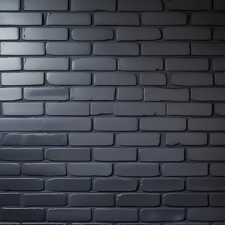 A detailed, close-up view of a dark gray painted brick wall. The image focuses on the texture of the bricks and the mortar. The paint appears to have a slightly worn or matte finish, and the individual bricks show subtle imperfections. The lighting creates a sense of depth and highlights the tactile quality of the surface.の素材