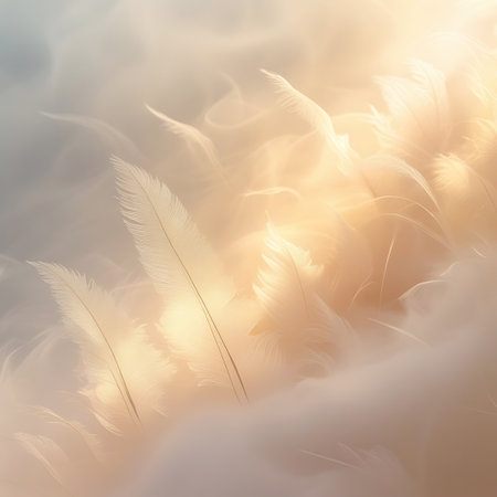 A close-up view of a cluster of soft, white feathers bathed in warm, golden light. The feathers appear delicate and airy, with a gentle glow emanating from the light source. The background is softly blurred, creating a serene and ethereal atmosphere with a pastel color palette.の素材