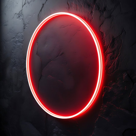 A vibrant red neon oval is illuminated against a dark, textured stone wall. The neon light creates a smooth, continuous glow that outlines the oval shape and casts a subtle red light onto the rough, uneven surface of the stone. The contrast between the sleek neon and the rugged stone is visually engaging, creating a modern and abstract composition.の素材