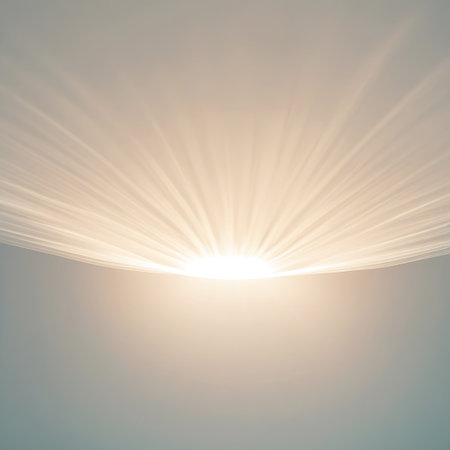 A soft, warm light emanates from the horizon, casting long, gentle rays upwards against a subtly shaded gradient background. The light is bright and luminous, creating an ethereal and peaceful atmosphere. The effect suggests a sunrise or sunset, evoking feelings of hope and new beginnings.の素材