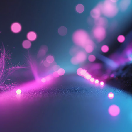 An abstract, low-angle view of a textured surface illuminated by glowing pink and blue lights. Soft bokeh circles are scattered across the scene, with some areas featuring luminous streaks and wisps of light, suggesting movement or energy. The color palette transitions from deep blue to vibrant pink and purple, creating a dynamic and futuristic feel.の素材