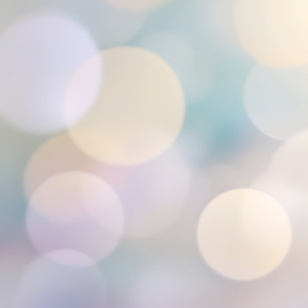 An abstract background filled with soft, blurred circles of light in pastel hues of yellow, lavender, and light blue. The bokeh effect creates a gentle, diffused atmosphere. The circles overlap and vary in size, contributing to a dreamy and serene visual experience. The lighting is soft and subtle.の素材