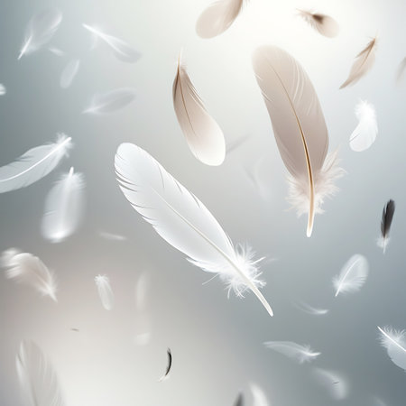 A collection of feathers, predominantly white with some brown and black accents, are shown in a state of gentle descent against a softly lit, blurred background. The light catches the delicate barbs of the feathers, creating a luminous and ethereal effect. The scene conveys a sense of quiet grace and natural beauty.の素材