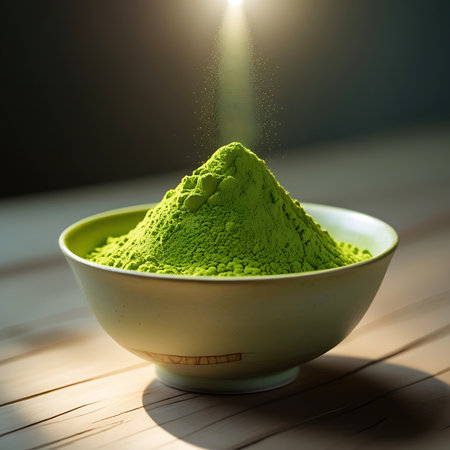 A close-up shot of a light-colored bowl filled with a generous mound of bright green matcha powder. The powder is shaped into a peak, and delicate light rays beam down from above, illuminating the fine texture and vibrant color. The bowl rests on a wooden surface, with a softly blurred dark background.の素材