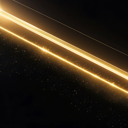 This abstract image features diagonal streaks of bright golden light against a dark, black background. Tiny, glittering golden particles are scattered across the scene, creating a sense of depth and sparkle. The light streaks are sharp and defined, with a subtle glow emanating from them. The overall impression is one of energy, motion, and futuristic elegance.の素材