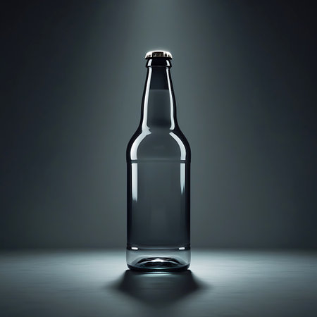 Bottle showing clear glass bottle with a silver cap on a dark surface. High resolution image suitable for commercial use.の素材