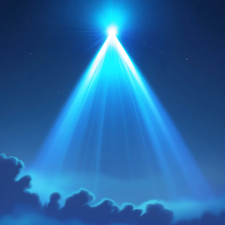 A brilliant blue light beam shines upwards through dark clouds in a starry night sky, creating a dramatic and ethereal effect.の素材