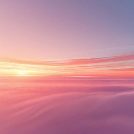 A vibrant pink and orange sunset sky with wispy clouds stretches across the horizon above a soft pink cloud layer.の素材