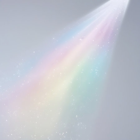 A soft pastel rainbow light beam with tiny glittering particles emanates from the top right against a muted grey background.の素材