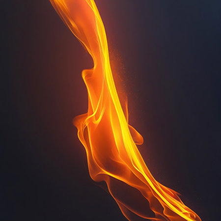 A vertical abstract shape resembling a flame in shades of orange and yellow, with glowing particles against a dark background.の素材