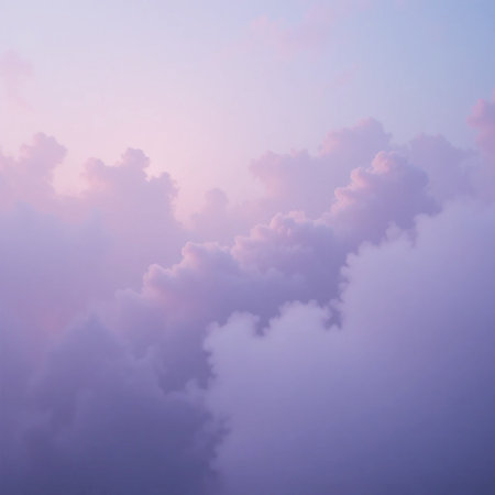 Soft purple and pink clouds drift across a serene sky, creating a dreamy and tranquil atmospheric background with gentle light.の素材