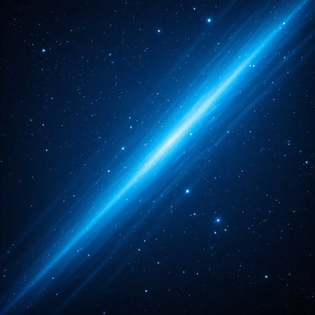 A vibrant blue light beam streaks diagonally across a dark, star-filled night sky, suggesting cosmic energy or travel.の素材