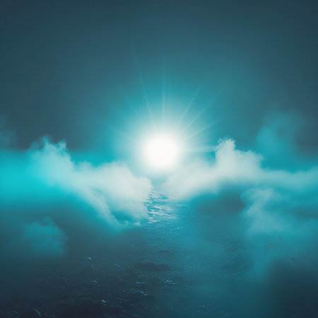 This image captures a tranquil scene of a sunrise over calm waters. The sun is partially obscured by a layer of clouds, casting a warm glow that illuminates the surrounding sky. The water below reflects the soft light, creating a peaceful and serene atmosphere. The overall mood of the image is calm and reflective, perfect for a quiet morning.の素材