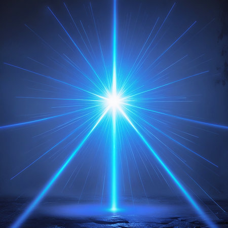 A mesmerizing image of a blue light display featuring a central bright light source emitting numerous beams in all directions. The beams create a radiant pattern against a dark background, suggesting a festive or celebratory atmosphere. The light beams are vivid and sharply defined, adding to the visual impact.の素材