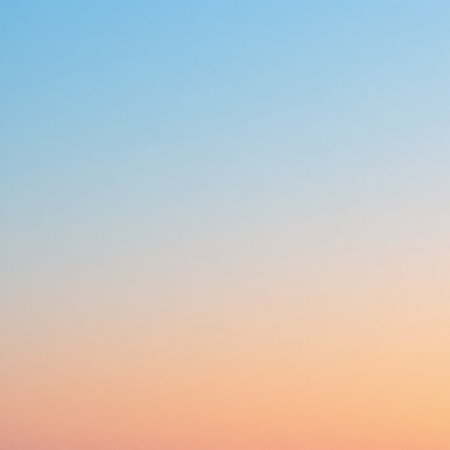 This image captures a serene and calming sunset sky. The gradient transitions smoothly from a soft blue at the top to a warm orange at the bottom, creating a peaceful and tranquil atmosphere. The sky is clear with no visible clouds, emphasizing the smooth blend of colors.の素材