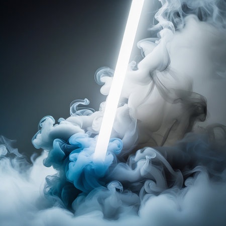 This image features a dramatic scene of smoke or fog with a bright light beam cutting through it. The smoke appears to be swirling and dense, with shades of gray and blue, creating an ethereal and mysterious atmosphere. The light beam adds a dynamic element, suggesting a sense of direction and illumination.の素材