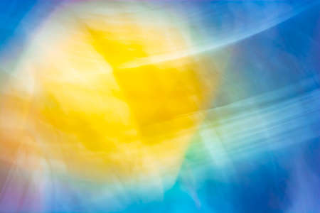 Abstract sun in the sky. Background in yellow orange blue tones.