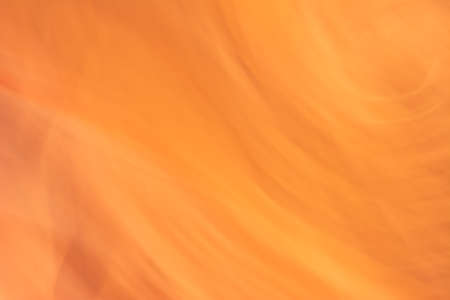 Abstract desert orange background. small waves. backdrop. Banner in warm colors.