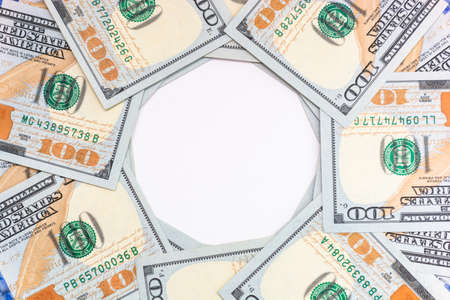 Background of one hundred dollar American bills with a white circle in the middle. business and...