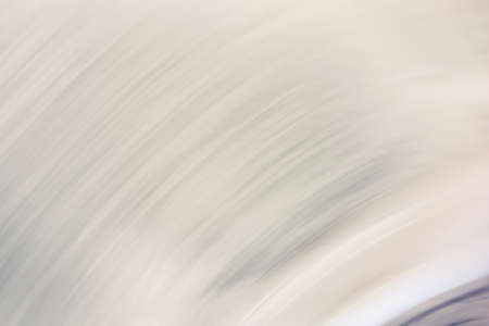 Abstract background in beige shades, thin lines of a semicircle of waves. backdropの写真素材