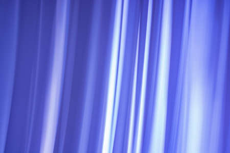 Abstraction of a curtain made of blue waves with gaps. background banner. backdropの写真素材
