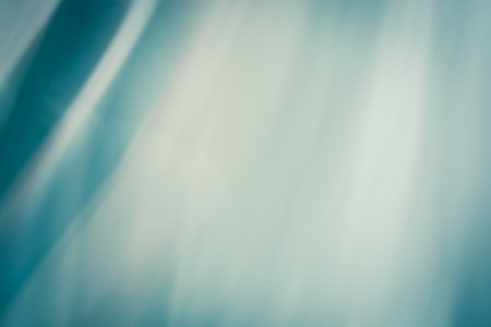 Stylish background in the form of an abstract curtain in cold turquoise tones with a gradient. backdropの写真素材