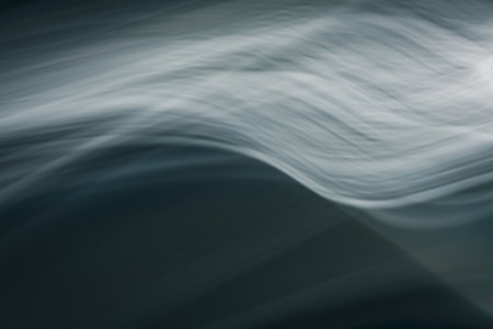Abstract waves in the cold ocean. Dark background with enlightenment. backdropの写真素材