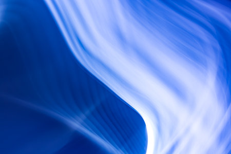 Abstract background banner of rising waves with a gradient from blue to white. backdropの写真素材