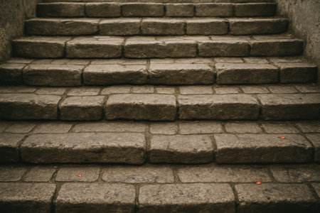 Weathered stone steps create a gentle ascent along a serene path. The warm evening light casts soft shadows, inviting exploration of this tranquil spot.の素材