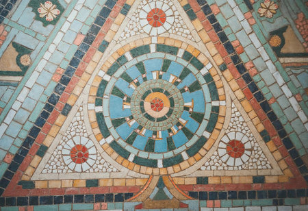This stunning mosaic features an array of vibrant colors arranged in geometric shapes, including triangles and circles.の素材