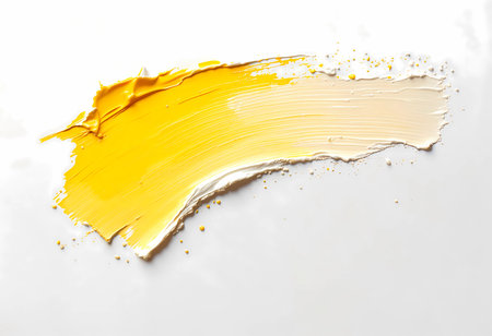 A sweeping arch of bright yellow and soft cream paint flows gracefully across a white surface, suggesting artistic expression and the joy of creativity. This colorful arrangement inspires imagination.の素材