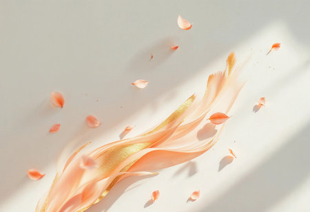 Blush-colored petals drift softly, intertwining with flowing golden ribbons on a light backdrop. Sunlight highlights their graceful movement, inviting tranquility and beauty.の素材