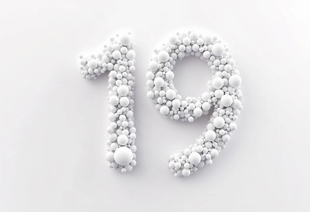 A creative arrangement of various sized white spheres seamlessly forms the number nineteen against a light background. The artistic display captivates with its elegant simplicity and texture.の素材